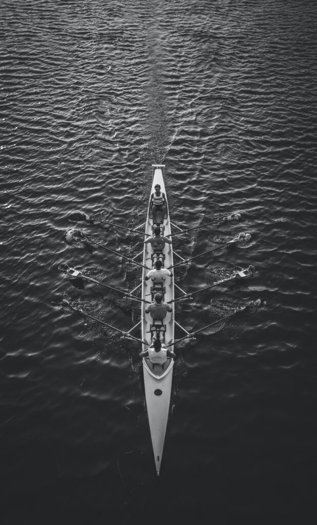 people riding boat on body of water